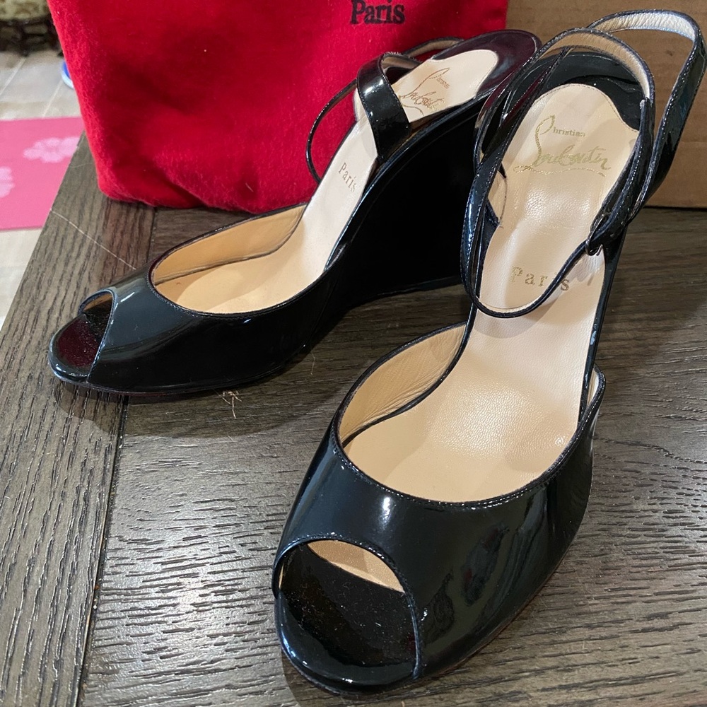 Black patent leather Louboutin wedge heels
